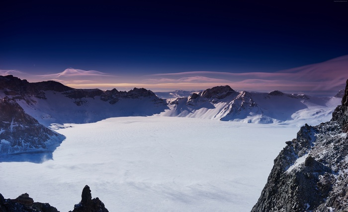 Snowy Changbai Mountains under a twilight sky