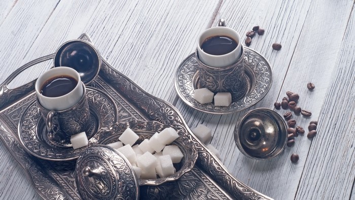 Turkish coffee set with sugar cubes and coffee beans