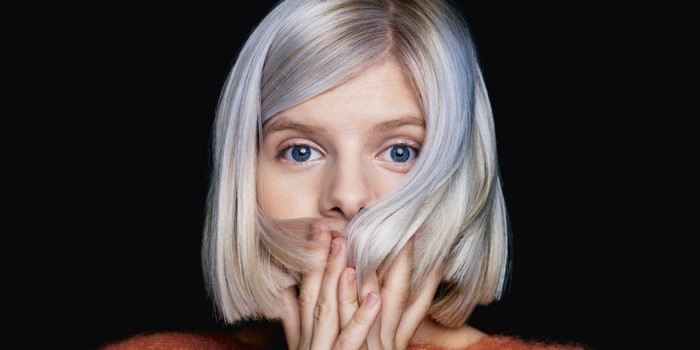 Portrait of Woman with Short White Hair and Blue Eyes