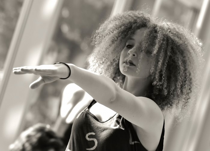 Woman with curly hair dancing