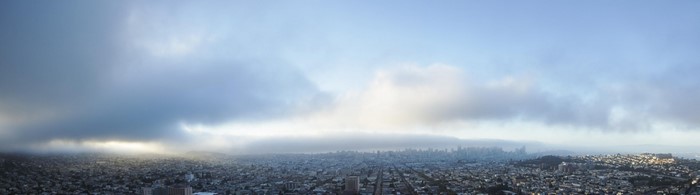 Panoramic view of San Francisco skyline through fog