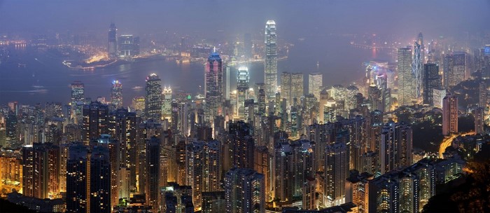 Hong Kong cityscape at night with skyscrapers and harbor