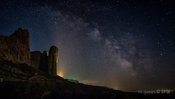 Milky Way over rock formations at night