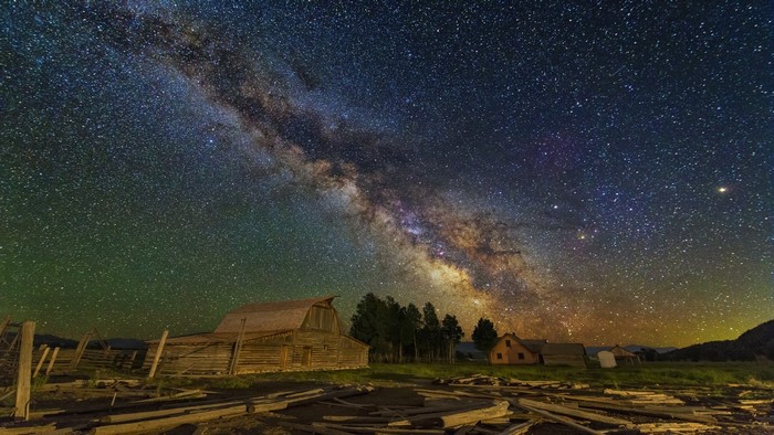 Milky Way over a rustic barn and landscape
