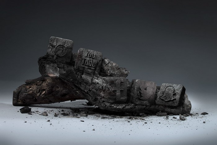 Burnt wood sculpture with social media logos