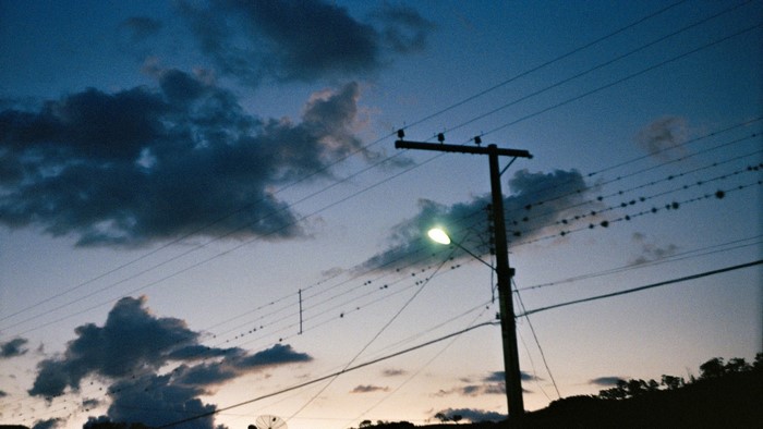 Street light and power lines at dusk