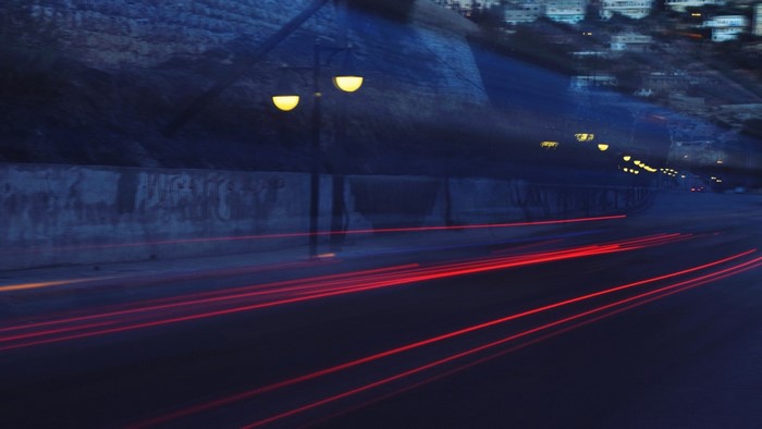Long exposure of traffic lights at night in a tunnel