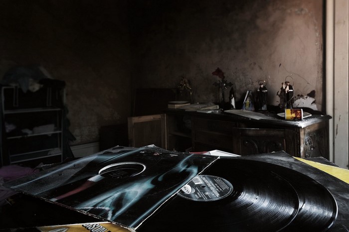 Vinyl records in a dark, dusty room