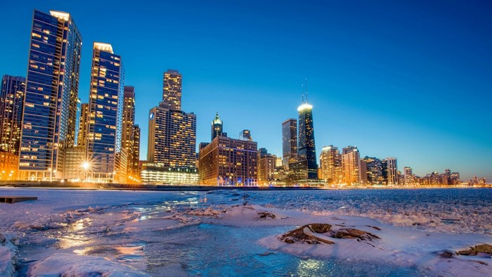 Chicago skyline at dusk with frozen lake