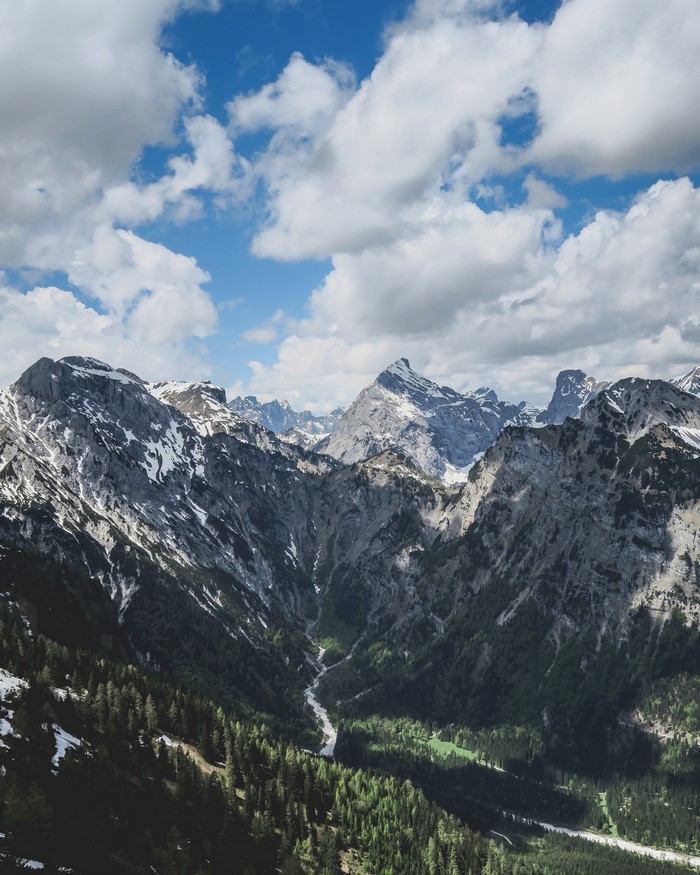 Mountain range with snow-capped peaks and green valley