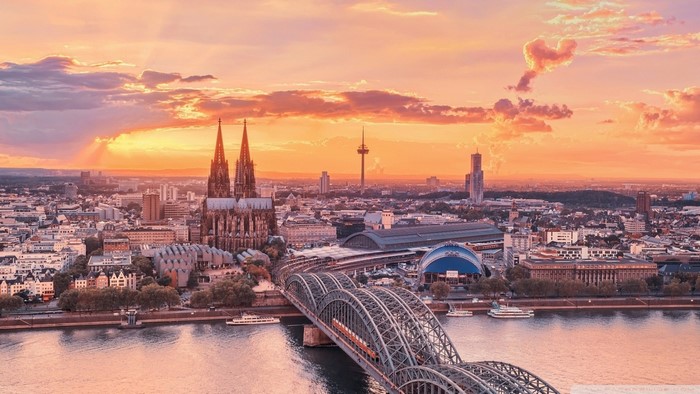 Cologne Cathedral and Hohenzollern Bridge at sunset