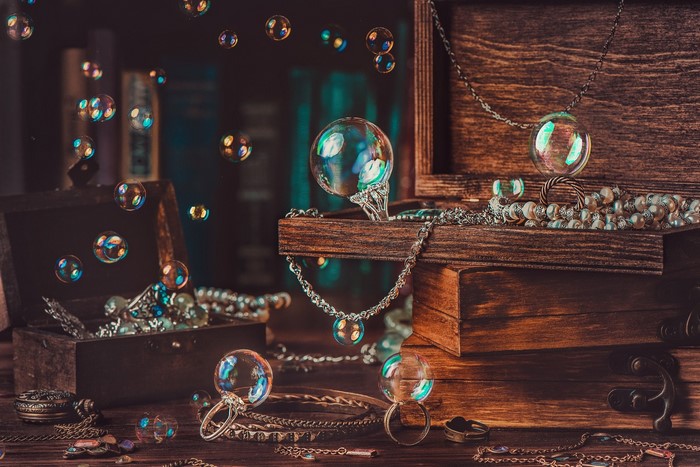 Bubbles and jewelry in wooden chests
