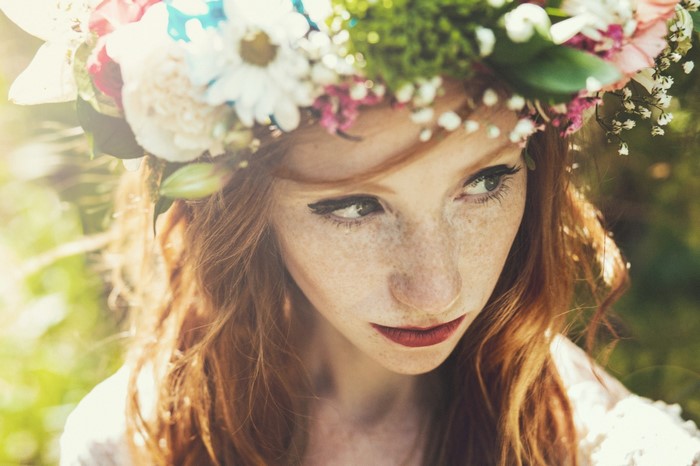 Woman with red hair and flower crown