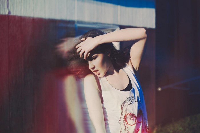 Woman with hand in hair, motion blur