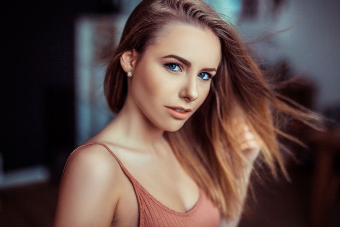 Woman with blue eyes and long brown hair
