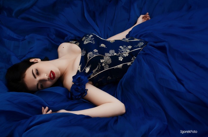 Woman in blue dress with floral pattern