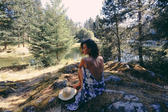 Nathalie Kelley in a dress by a lake