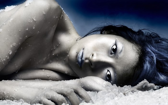 Asian woman with ice and blue background
