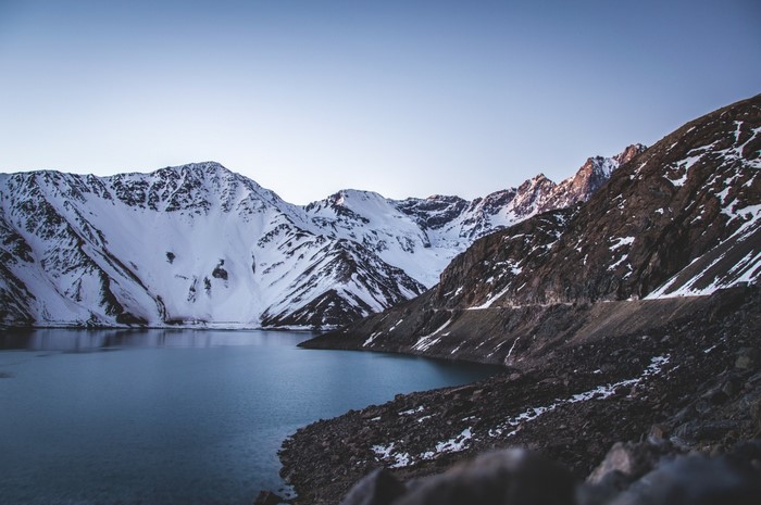 Snow-capped mountains overlooking a serene lake