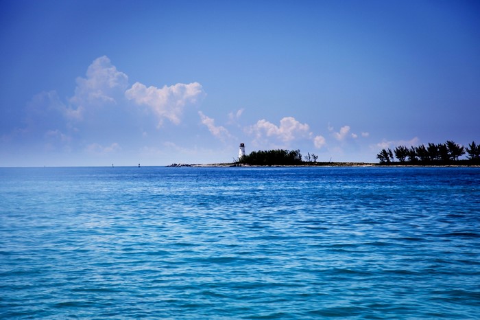 Lighthouse on a small island in the ocean