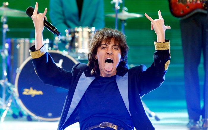 Singer performing on stage with a microphone