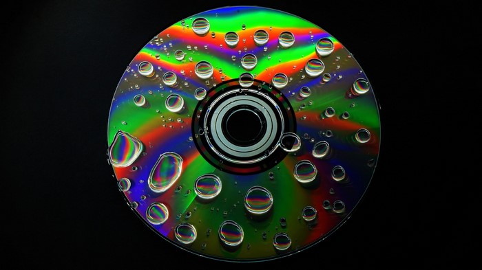 CD with water drops and rainbow colors