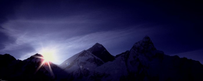 Sunrise over snow-capped mountains