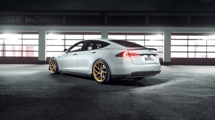 White Tesla Model S with gold rims
