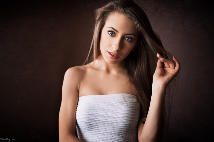 Woman with long brown hair and blue eyes