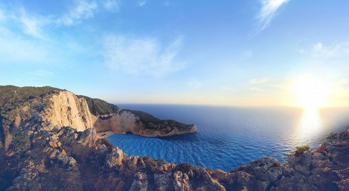 Panoramic view of a cliff overlooking the sea at sunrise