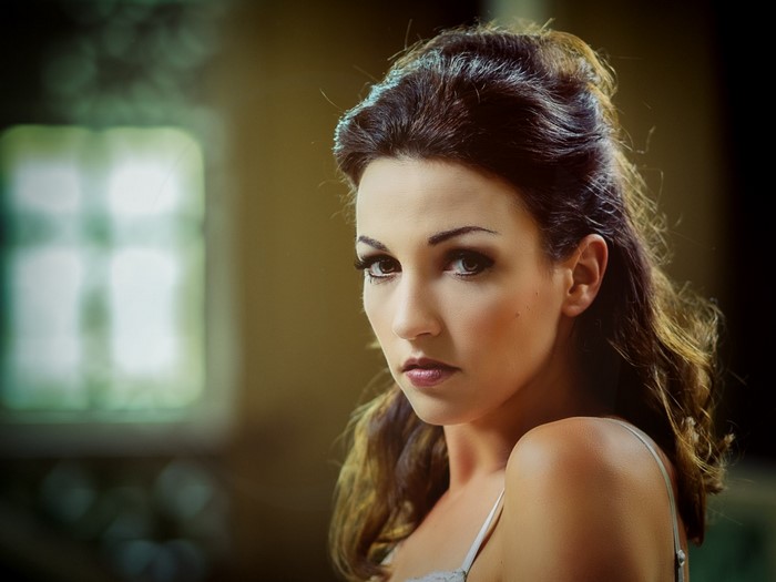 Woman with brown hair and makeup