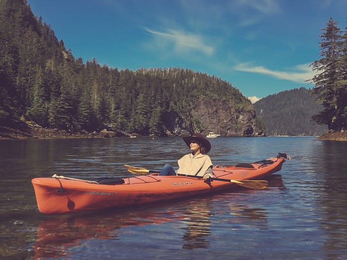 Nathalie Kelley kayaking in a lake