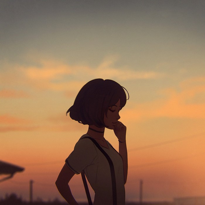 Girl in silhouette against a sunset sky