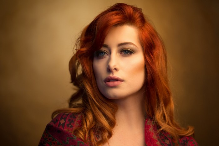 Portrait of a Redhead Woman with Blue Eyes