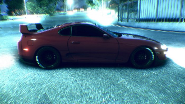 Red Toyota Supra sports car on a street