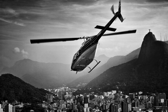 Helicopter flying over Rio de Janeiro with Christ the Redeemer statue
