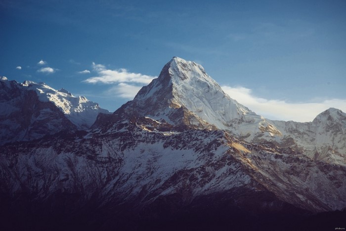 Snow-capped Annapurna mountain range under a blue sky