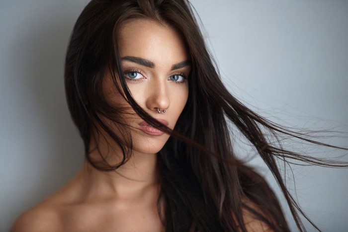 Portrait of a Woman with Long Dark Hair and Nose Ring