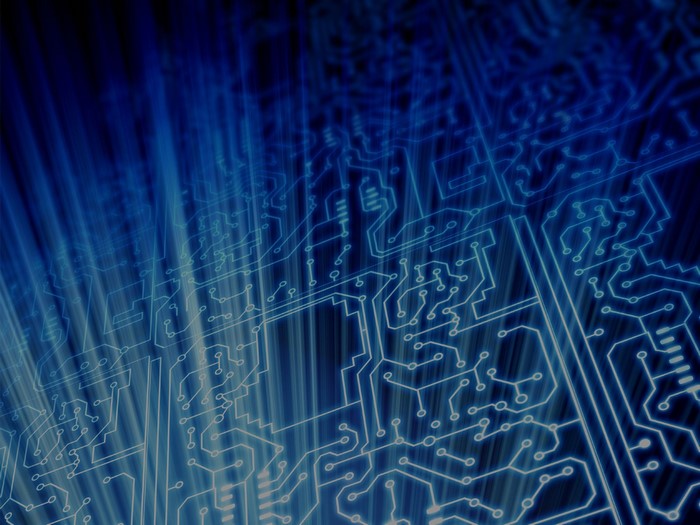 Abstract blue circuit board with light rays
