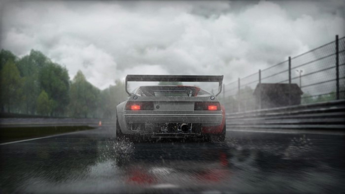 BMW M1 Procar driving on a wet race track in the rain