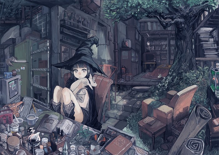 Girl in witch hat holding a rabbit in a cluttered room