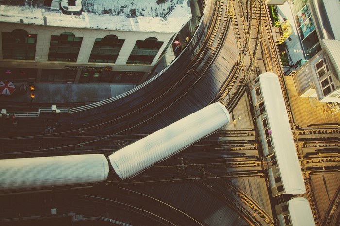 Elevated train tracks and trains in a city