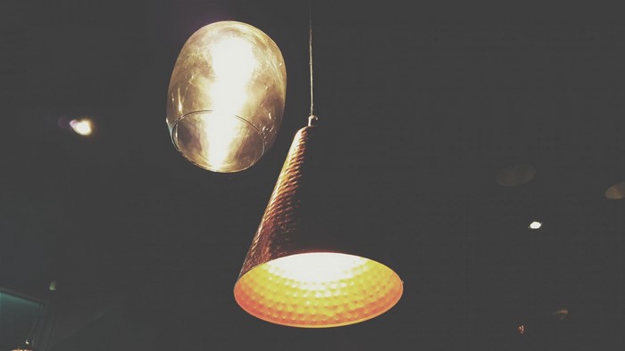 Two modern pendant lights hanging from the ceiling