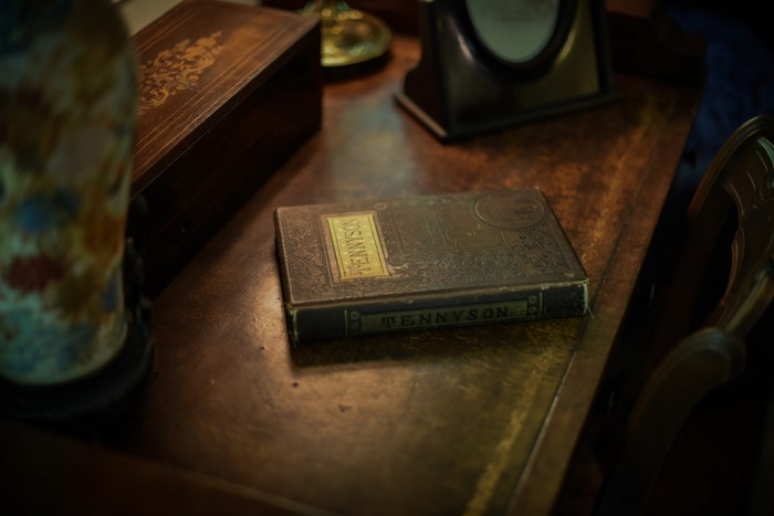Book titled Tennyson on a wooden desk