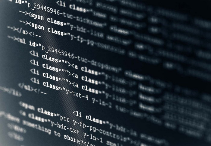 Computer screen displaying HTML code with syntax highlighting