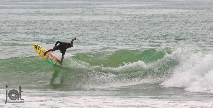 Surfer riding a wave in Bocas del Toro, Panama