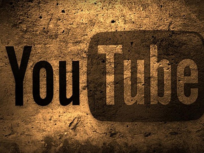 YouTube Logo on Textured Wall Background