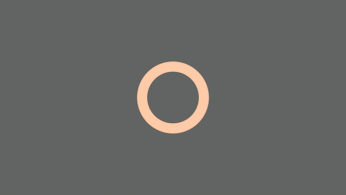A simple peach ring on a gray background