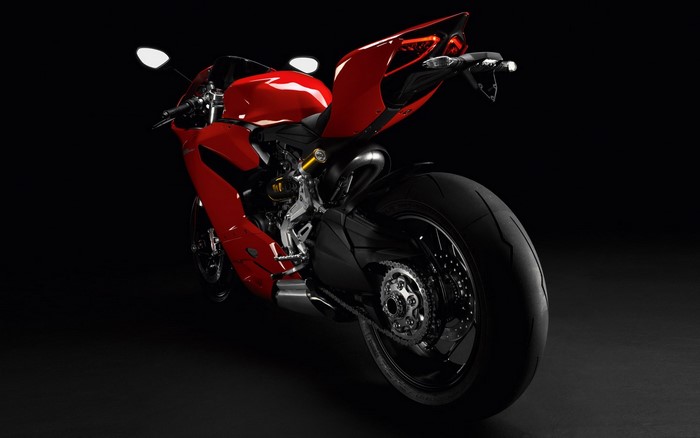 Red Ducati motorcycle with black background