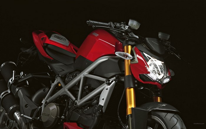 Red Ducati motorcycle with gold forks